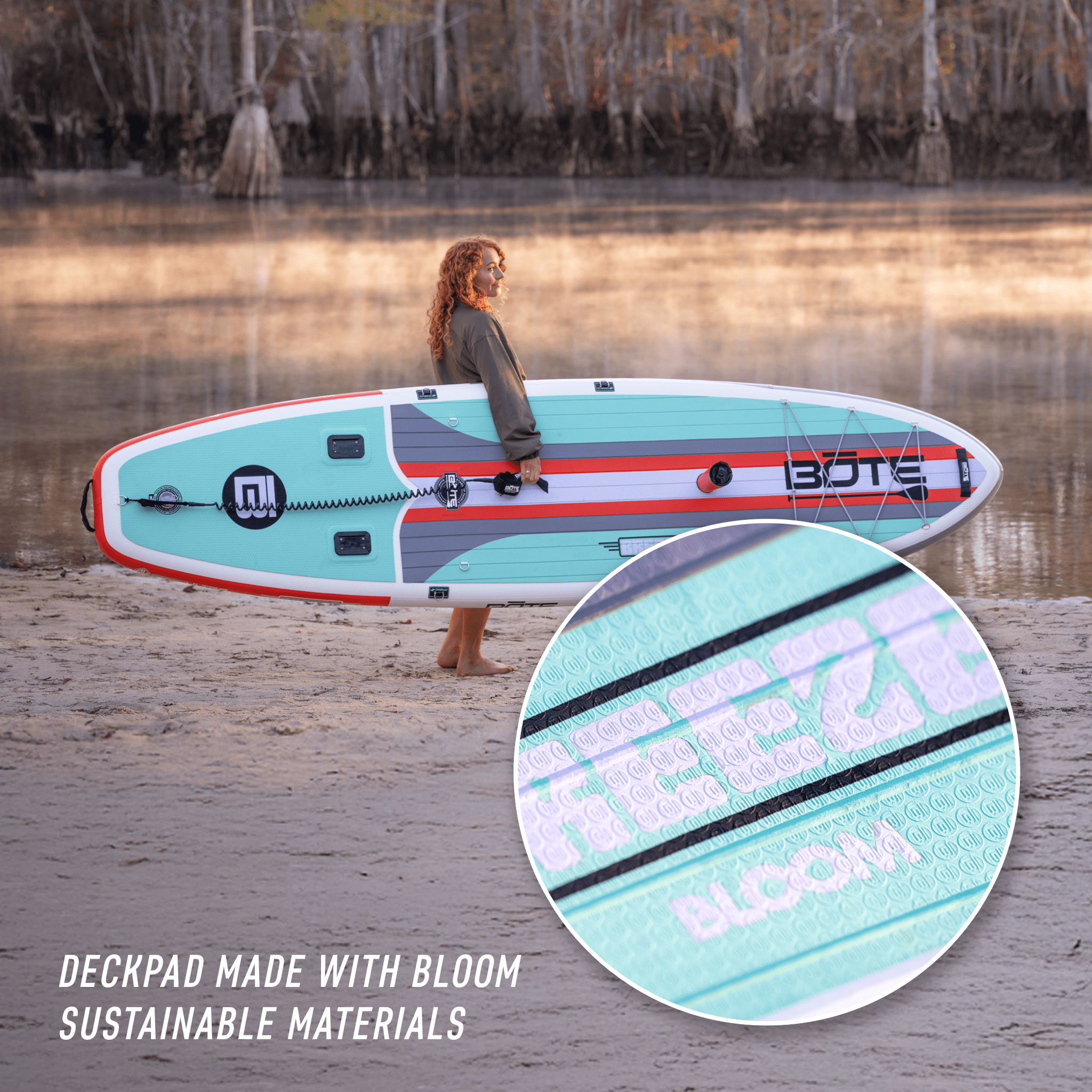 A girl holding the Breeze Aero 10'6" Full Trax Bloom Inflatable Paddle Board near the shore