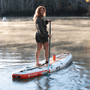 A girl paddling on the Breeze Aero 11'6" Full Trax Bloom Inflatable Paddle Board