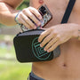 A person placing a phone in the Highwater Hitchhiker XL Black